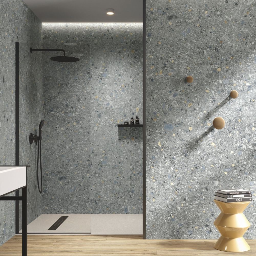 Blue terrazzo effect porcelain tile on bathroom floor