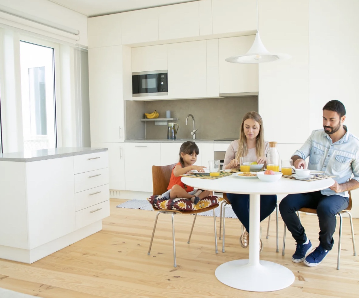 Cleaning modern flooring in a bright interior