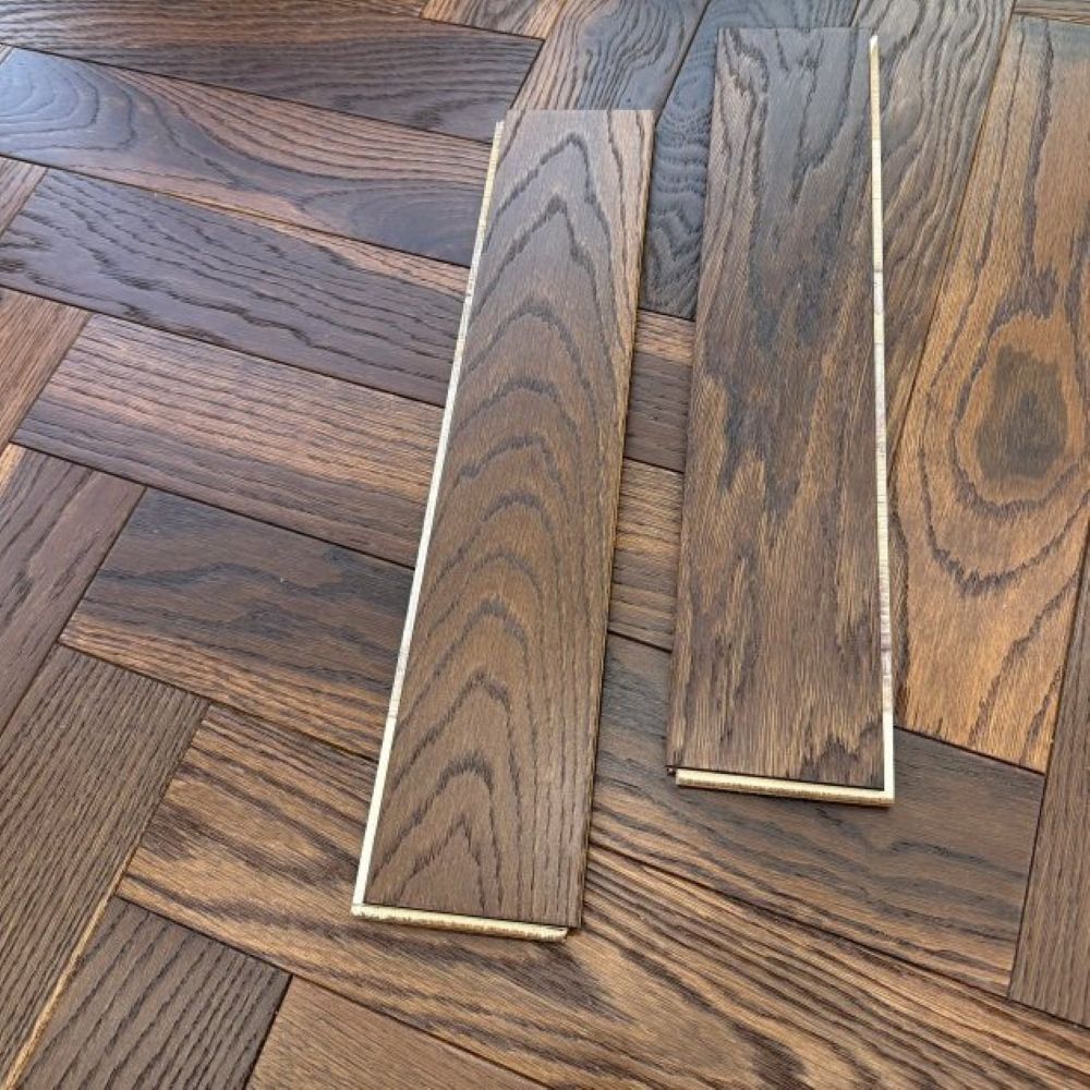 Smoked herringbone parquet flooring in a premium interior