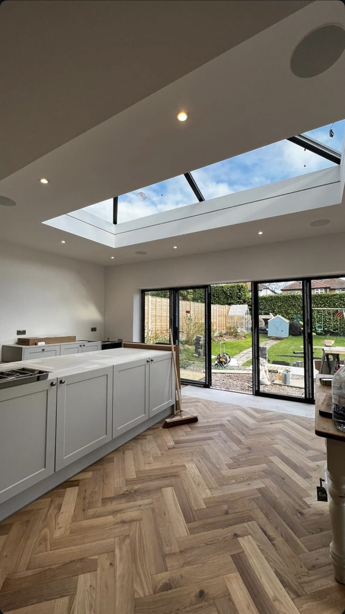 Engineered wood in a herringbone layout with a classic premium feel